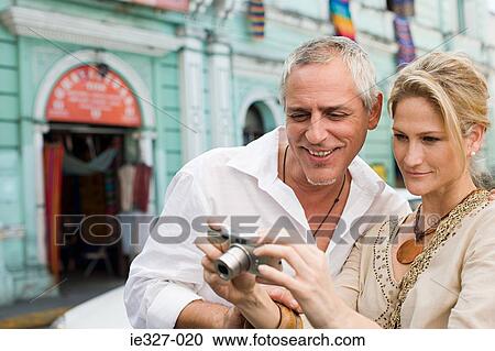Couple looking at camera View Large Photo Image Stock Image - Couple looking at camera. Fotosearch