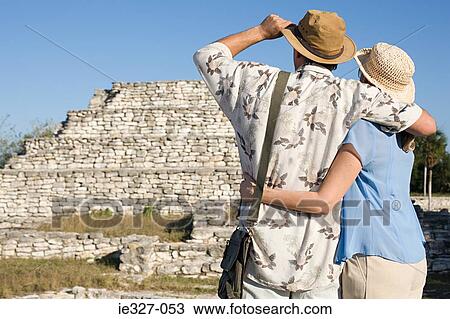 Couple looking at ruins View Large Photo Image Stock Image - Couple looking at ruins. Fotosearch