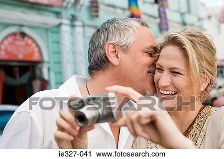 Couple with camera View Large Photo Image Stock Image - Couple with camera. Fotosearch