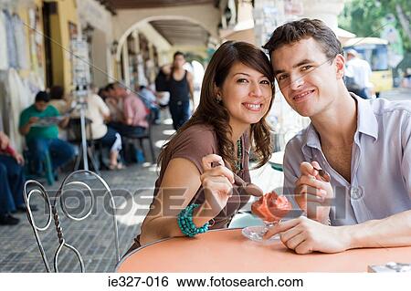 Couple with dessert View Large Photo Image Stock Photograph - Couple with dessert. Fotosearch