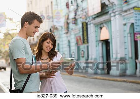 Stock Photo - Couple with map. Fotosearch