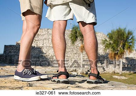 Legs of tourists at ruins View Large Photo Image Stock Image - Legs of tourists at ruins. Fotosearch