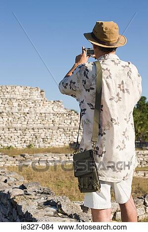 Man photographing ruins View Large Photo Image Picture - Man photographing ruins. Fotosearch