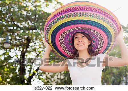 Woman wearing sombreros View Large Photo Image Stock Image - Woman wearing sombreros. Fotosearch