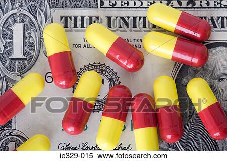 Capsules on a dollar bill View Large Photo Image Stock Photography - Capsules on a dollar bill. Fotosearch