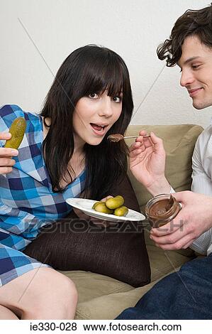 Pregnant woman craving food View Large Photo Image Stock Photo - Pregnant woman craving food. Fotosearch