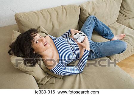 Pregnant woman with baby shoes View Large Photo Image Stock Photograph - Pregnant woman with baby shoes. Fotosearch