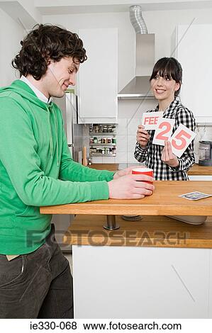 Woman holding a calendar date View Large Photo Image Stock Photo - Woman holding a calendar date. Fotosearch