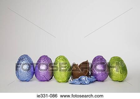 Stock Photograph - Easter eggs in a row. Fotosearch