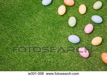 Easter eggs on grass View Large Photo Image Stock Photograph - Easter eggs on grass. Fotosearch