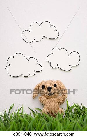Stock Photograph - Knitted toy dog. Fotosearch