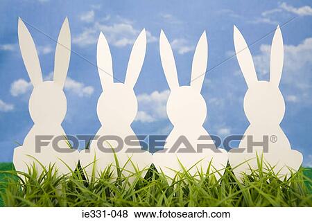 White rabbit shapes in a row View Large Photo Image Stock Photo - White rabbit shapes in a row. Fotosearch