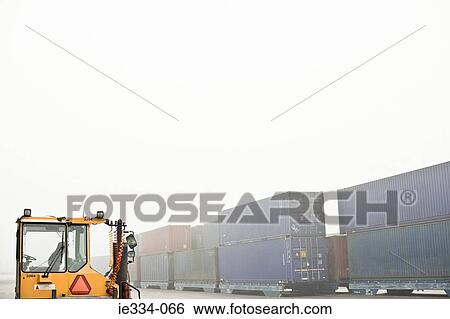 Forklift and cargo containers View Large Photo Image Stock Photograph - Forklift and cargo containers. Fotosearch