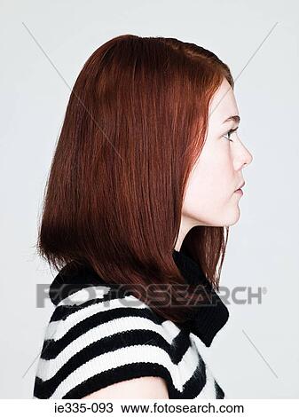 Stock Image - Profile of a young woman. Fotosearch