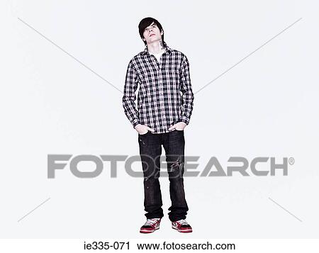 Stock Image - Young man looking up. Fotosearch