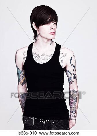 Young man with tattoos View Large Photo Image Stock Image - Young man with tattoos. Fotosearch