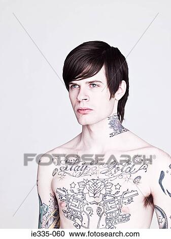 Stock Image - Young man with tattoos. Fotosearch