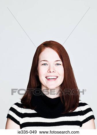 Young woman smiling View Large Photo Image Stock Photo - Young woman smiling. Fotosearch