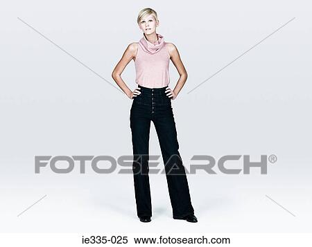 Young woman with hands on hips View Large Photo Image Stock Photography - Young woman with hands on hips. Fotosearch