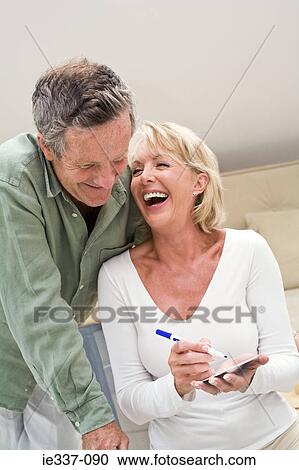 Couple laughing View Large Photo Image Stock Image - Couple laughing. Fotosearch