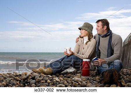 Couple on a beach View Large Photo Image Stock Image - Couple on a beach. Fotosearch