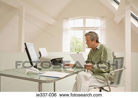 Man using computer View Large Photo Image Stock Photograph - Man using computer. Fotosearch
