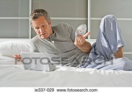 Man with portable dvd player View Large Photo Image Stock Photo - Man with portable dvd player. Fotosearch