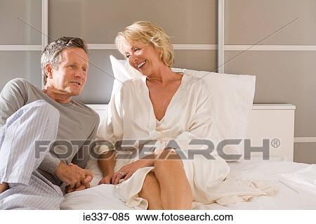 Mature couple on bed View Large Photo Image Stock Photography - Mature couple on bed. Fotosearch