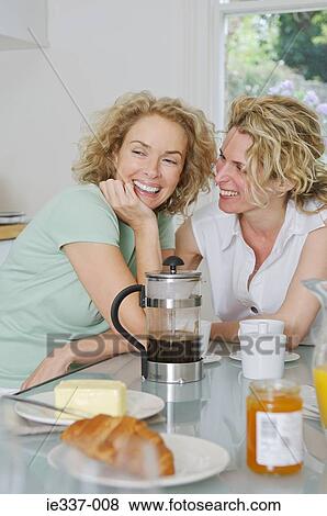 Woman at breakfast table View Large Photo Image Stock Photo - Woman at breakfast table. Fotosearch