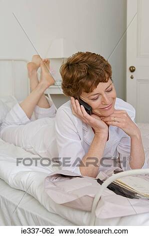 Woman on cellphone View Large Photo Image Stock Image - Woman on cellphone. Fotosearch
