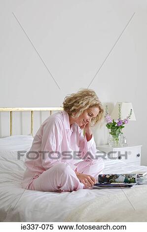 Woman reading magazine View Large Photo Image Stock Photography - Woman reading magazine. Fotosearch