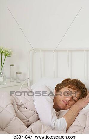 Woman sleeping View Large Photo Image Stock Photo - Woman sleeping. Fotosearch