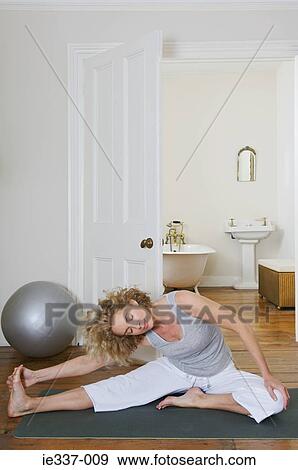 Woman stretching View Large Photo Image Stock Photo - Woman stretching. Fotosearch