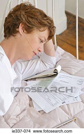 Woman with bills View Large Photo Image Picture - Woman with bills. Fotosearch