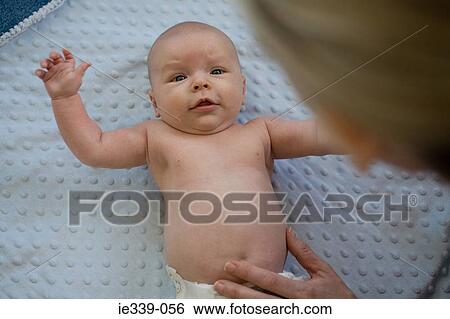 Stock Photograph - Baby and mother. Fotosearch