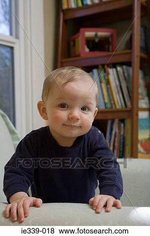 Baby boy in a chair View Large Photo Image Stock Photo - Baby boy in a chair. Fotosearch
