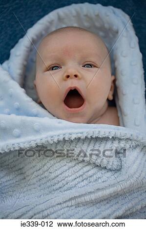 Stock Image - Baby in a blanket. Fotosearch