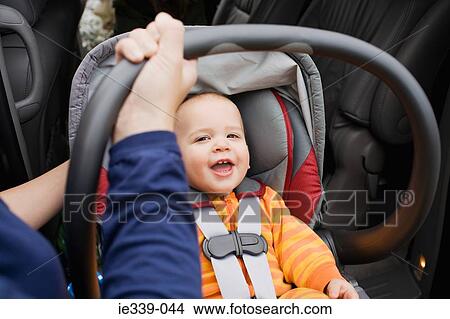 Picture - Baby in car seat. Fotosearch