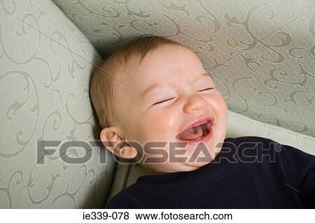 Stock Photo - Baby laughing. Fotosearch
