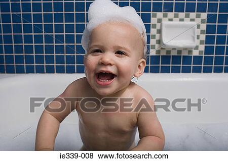 Baby taking a bath View Large Photo Image Stock Photo - Baby taking a bath. Fotosearch