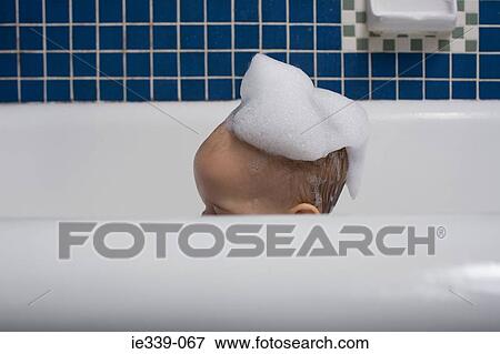 Baby with bubbles on their head View Large Photo Image Stock Photo - Baby with bubbles on their head. Fotosearch