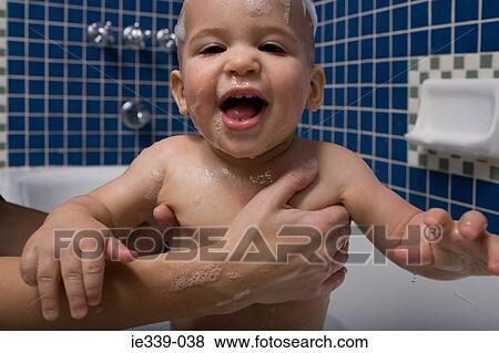 Bathing baby View Large Photo Image Stock Photo - Bathing baby. Fotosearch
