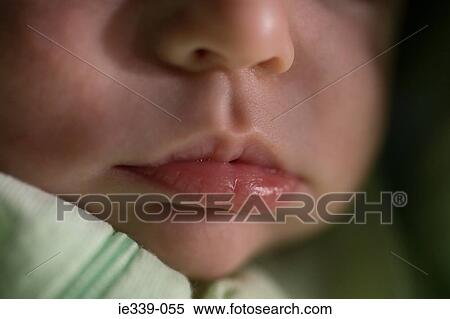 Stock Photography - Close up of baby face. Fotosearch