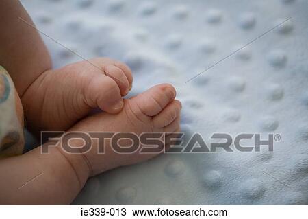 Stock Image - Feet of a baby. Fotosearch