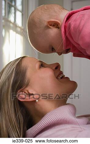 Stock Photography - Happy mother and baby girl. Fotosearch