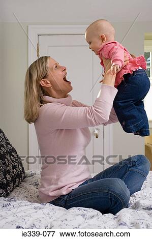 Mother and baby girl View Large Photo Image Stock Photo - Mother and baby girl. Fotosearch