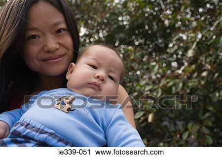 Mother and baby outdoors View Large Photo Image Stock Image - Mother and baby outdoors. Fotosearch