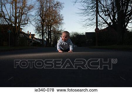 Baby crawling in road View Large Photo Image Stock Photo - Baby crawling in road. Fotosearch