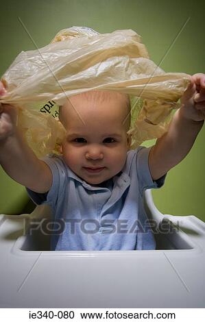 Baby in danger with plastic bag View Large Photo Image Stock Image - Baby in danger with plastic bag. Fotosearch
