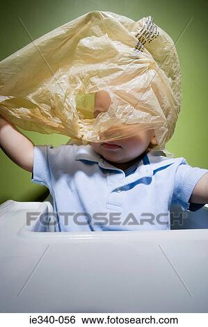 Baby in danger with plastic bag View Large Photo Image Stock Photograph - Baby in danger with plastic bag. Fotosearch